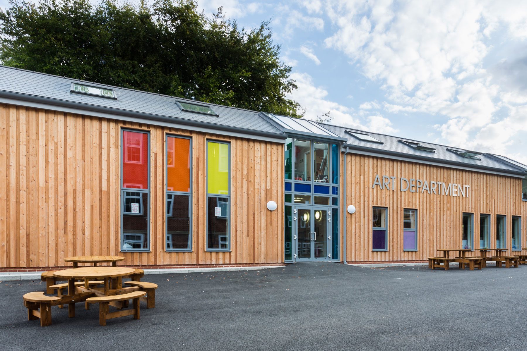 Guildford County School- New Art Block with vertical timber cladding and low pitched slate roof