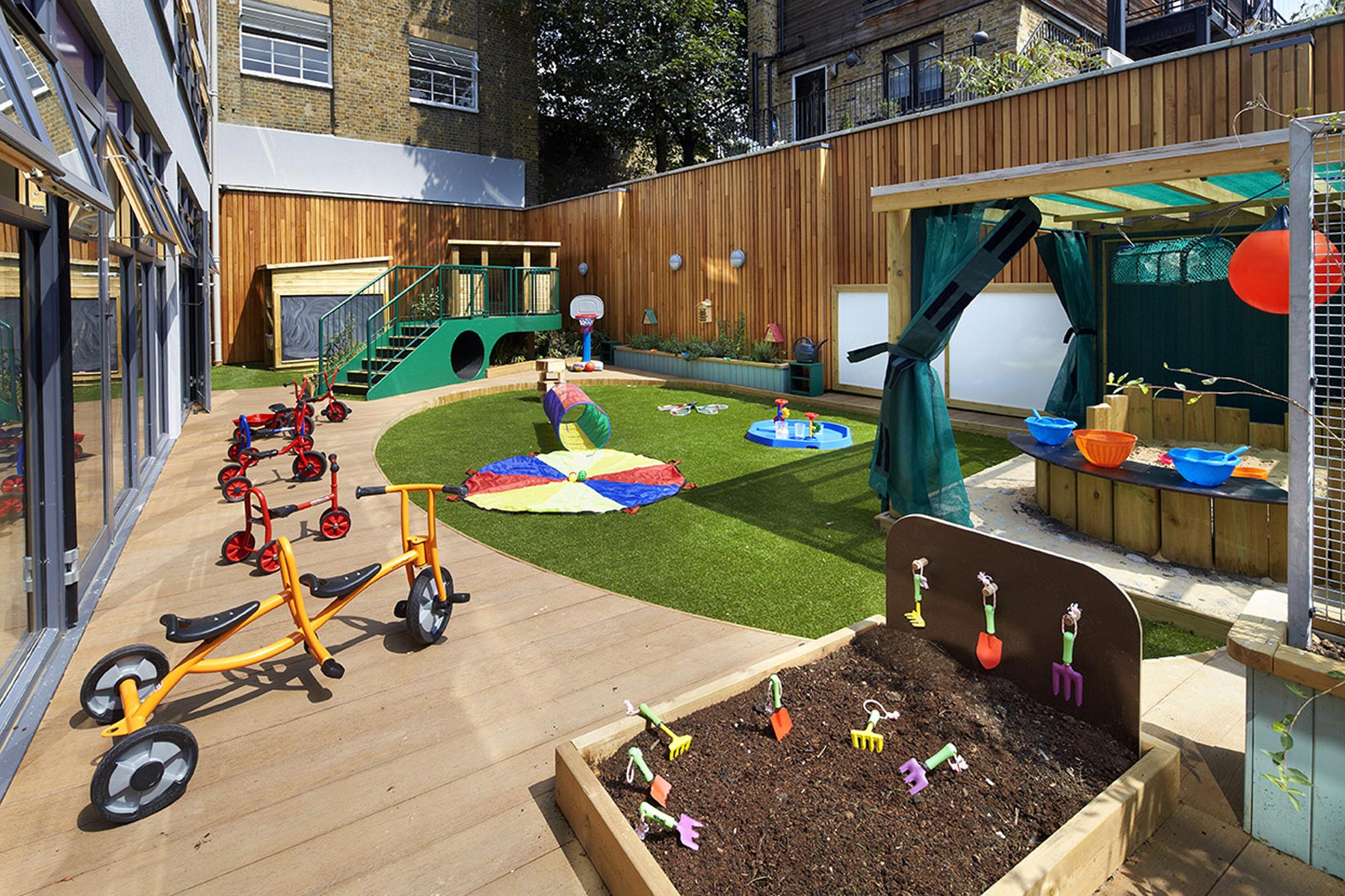 Bromells Road Nursery - Timber paneled playground